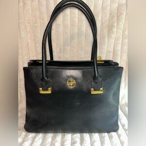Segolene Paris Black and Gold Shoulder Bag with Minimalist Elegance